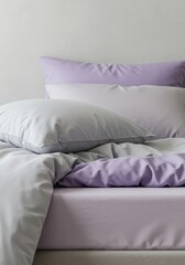 A tranquil bedroom scene showcasing soft, layered textiles in soothing pale gray and light lavender, promoting calmness and rest ,contemporary, gray, pale