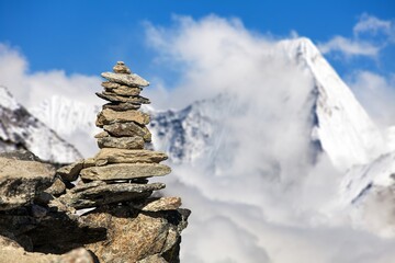 Stone pyramid or stone man and beautiful mount