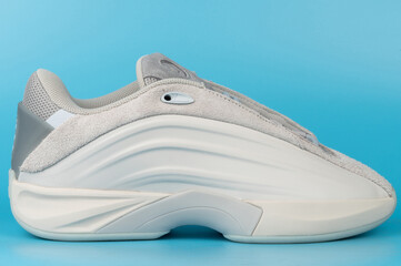 Modern sneaker design on blue background with side view