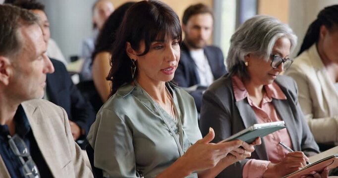 Business, tablet and question with woman in crowd of development seminar for feedback or solution. App, conference and speaking with mature employee in audience of workshop for discussion or query