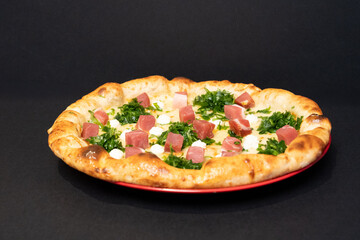 Delicious freshly baked pizza displayed against a clean black background for modern food photography