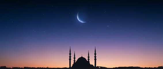 Muslim mosque silhouette and the moon in the night sky. Ramadan festive, islam religion. High quality photo