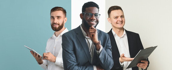 Three business professionals stand together in a stylish office space. They engage with tablets and documents while sharing ideas, showcasing teamwork and collaboration in a contemporary environment.