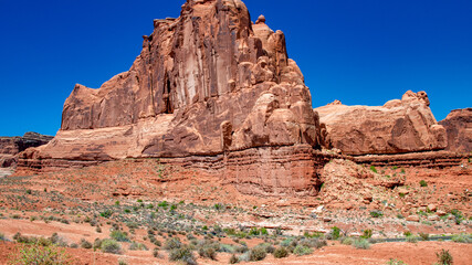 Fototapeta premium Arches National Park in summer season with red sandstone formations and clear blue sky in Utah