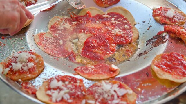 Preparing traditional mexican chalupas in puebla
