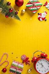 Bright vertical yellow backdrop featuring Christmas and New Year symbols such as gifts, candy canes, ornaments, a small tree, and a red clock