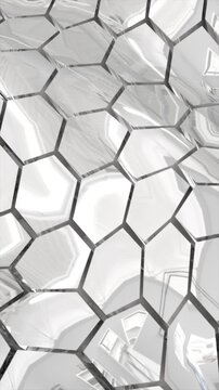 Reflective silver hexagonal surface with distorted mirrored reflections creating a modern abstract texture