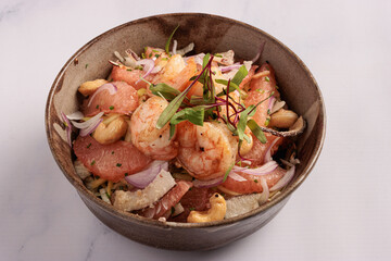 fresh shrimp and grapefruit salad with red onion, cashews and microgreens