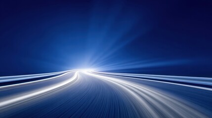 Abstract image of light trails on a road showing motion and speed with a blue background emphasizing a sense of journey and travel beyond the horizon