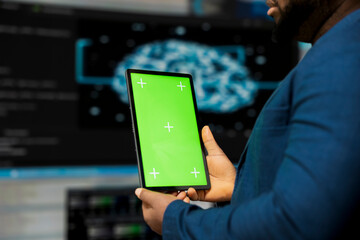 Black tech savvy programmer uses chroma key screen from innovation hub, working on digital transformation with software engineering and data science. Cybersecurity and automation.