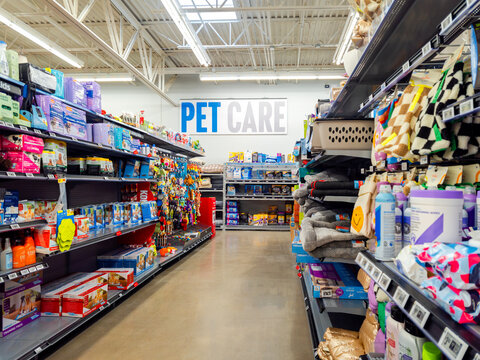 Utica, NY - Dec 7, 2025: Pet care aisle in a Walmart Supercenter offering grooming, nutrition, and accessories for birds, dogs, and cats, reflecting category growth across general merchandise