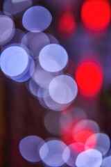 Blurred background of colorful Christmas bokeh lights creating a festive atmosphere, enhancing holiday spirit and warmth in a vibrant, dreamy scene