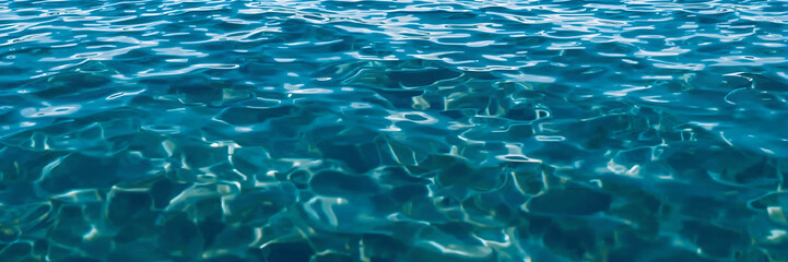 Clear Turquoise Water with Ripples and Reflections