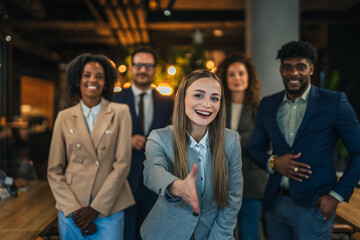 Diverse business team welcoming new employees to the office