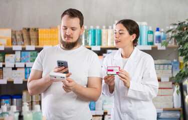 Man scans QR code on box paracetamol pills label. Female pharmacist offers to choose the right...