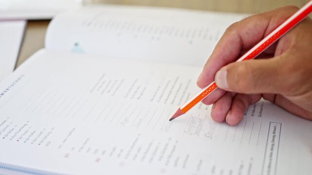 Student Persistently Works Through Practice Exercises With Focused Attention, An Attentive Learner Diligently Completes Their Educational Worksheets With Careful Concentration And Effort