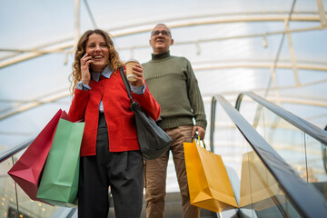 Happy couple enjoying shopping at a modern mall