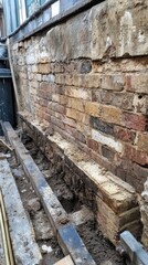 A brick wall with a hole in it