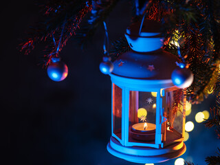 Christmas lantern on a Christmas tree branch. New Year's Eve