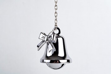 Christmas Bell Chrome Decoration: Shiny Metal Holiday Ornament with Bow - Elegant Silver Home Decor and Festive Celebration Item