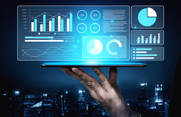 A modern tablet displaying vibrant data visualizations, graphs, and charts under a night cityscape. Ideal for themes of analytics, technology, and digital innovation. Gantry