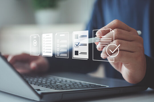 Businessman using laptop for digital document management paperless approval, technology workflow automation business process efficiency project authorization and corporate management approval concept.