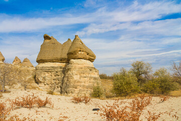 Cappadocia valley in Turkey. Cappadocia rock formation sites and chimneys Love Valley. Tuff volcanic rock pillars and mushrooms in the museum under open sky in Cappadocia turkish famous tourist sight