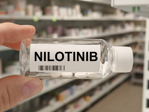 Box of NILOTINIB tablets on a hospital pharmacy table used to treat chronic myeloid leukemia a tyrosine kinase inhibitor.