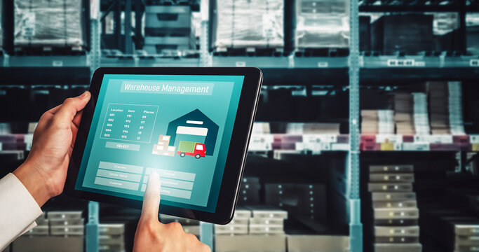 Warehouse management innovative software in computer for real time monitoring of goods package delivery . Computer screen showing smart inventory dashboard for storage and supply chain distribution .