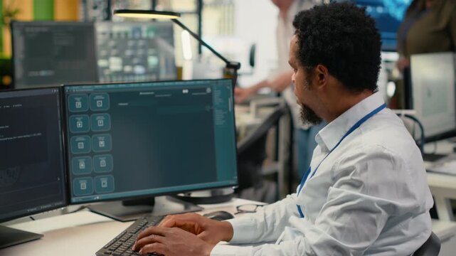 Programmer in office using AI LLM chatbot to get help optimizing systems performance metrics. IT worker in tech agency utilizing generative AI LLM assistant for faster software development, camera B