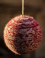 Macro close-up on soft hand-knitted wool Christmas ornament