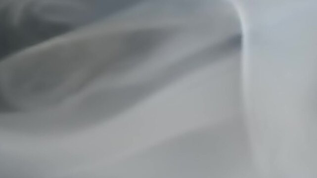 Abstract smoky spiral with gray background.