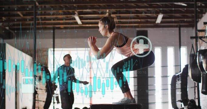 Woman timing box jumps to man swinging jump rope, teal data overlays tracking fitness metrics