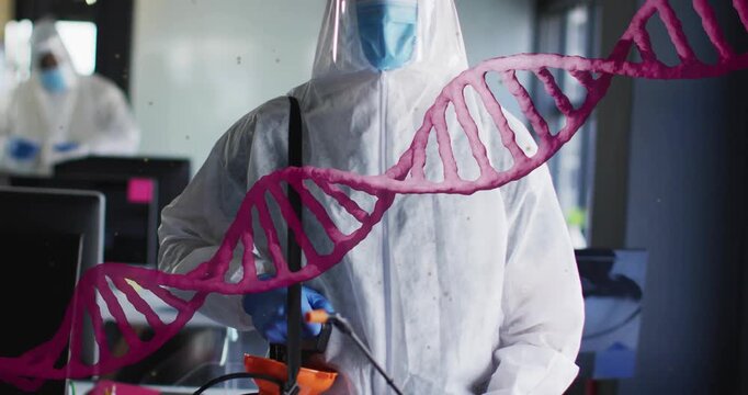 Male tech pumping sprayer prepping lab to clean while magenta DNA helix drifting across face shield