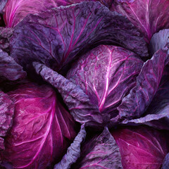 Fresh whole red cabbage on a clean surface, showcasing rich purple color and natural shine. Ideal for food markets, vegan diets, and farm-to-table concepts.