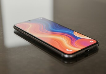 Modern Smartphone with Vibrant Display Resting on Dark Surface