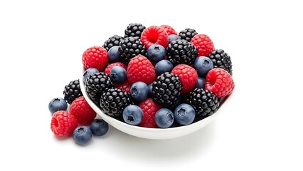 Freshly picked vibrant mixed berries overflowing from a white bowl, a delicious and healthy treat perfect for summer recipes and desserts, a culinary delight