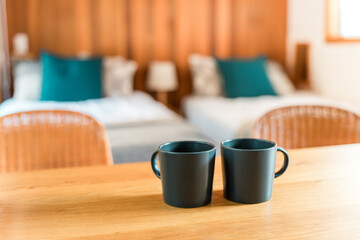 A pair of mugs and coffee cups on the table