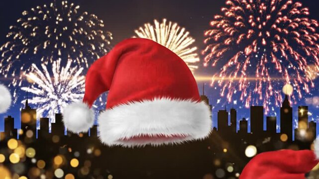 Festive red santa hats floating against a night sky with fireworks and city silhouette