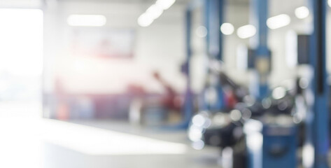 Blurry interior view of a bright automotive repair garage with lifts, enhanced by warm diffused lighting and soft indistinct shapes that create a calm spacious atmosphere.