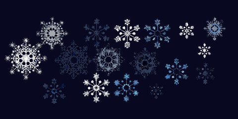 A collection of delicate snowflakes against a dark navy blue background