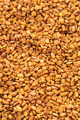 Heap of natural aromatic fenugreek seeds - Healthy food