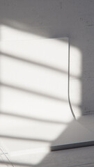 Minimal 3D scene with curved white backdrop and concrete texture. Ideal for product display, branding, and modern design mockups with natural light and shadow play.