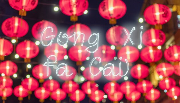 Red Lantern String Lights. Gong Xi Fa Cai. Abstract festivity with the text [Gong Xi Fa Cai] in a soft glowing neon font. dreamy and vibrant with a blurry red and golden point of light scheme..
 - Powered by Adobe