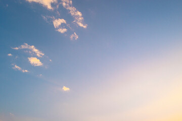 golden light before sundown. copy space.Blue sky with soft cloud on sunrise or sunset time. Nature background