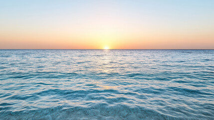 Sunrise ocean horizon calm sea gentle waves glowing sky