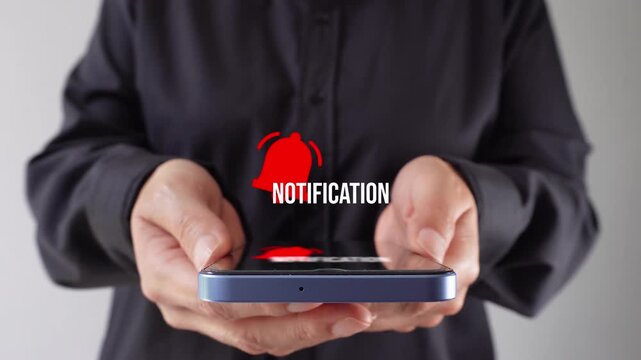 Businesswoman holding a smartphone with a floating notification bell animation