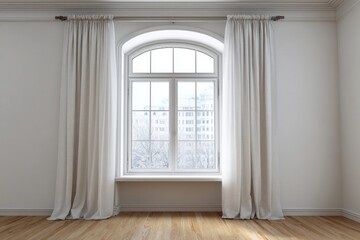 Fototapeta premium Bright arched window with white curtains overlooks a winter cityscape.