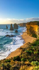 Coastal landscape featuring sea stacks, cliffs, and a sandy beach under a blue sky