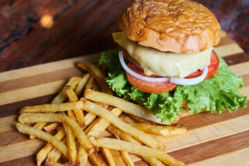 Gourmet Burgers With French Fries on a Wooden Table